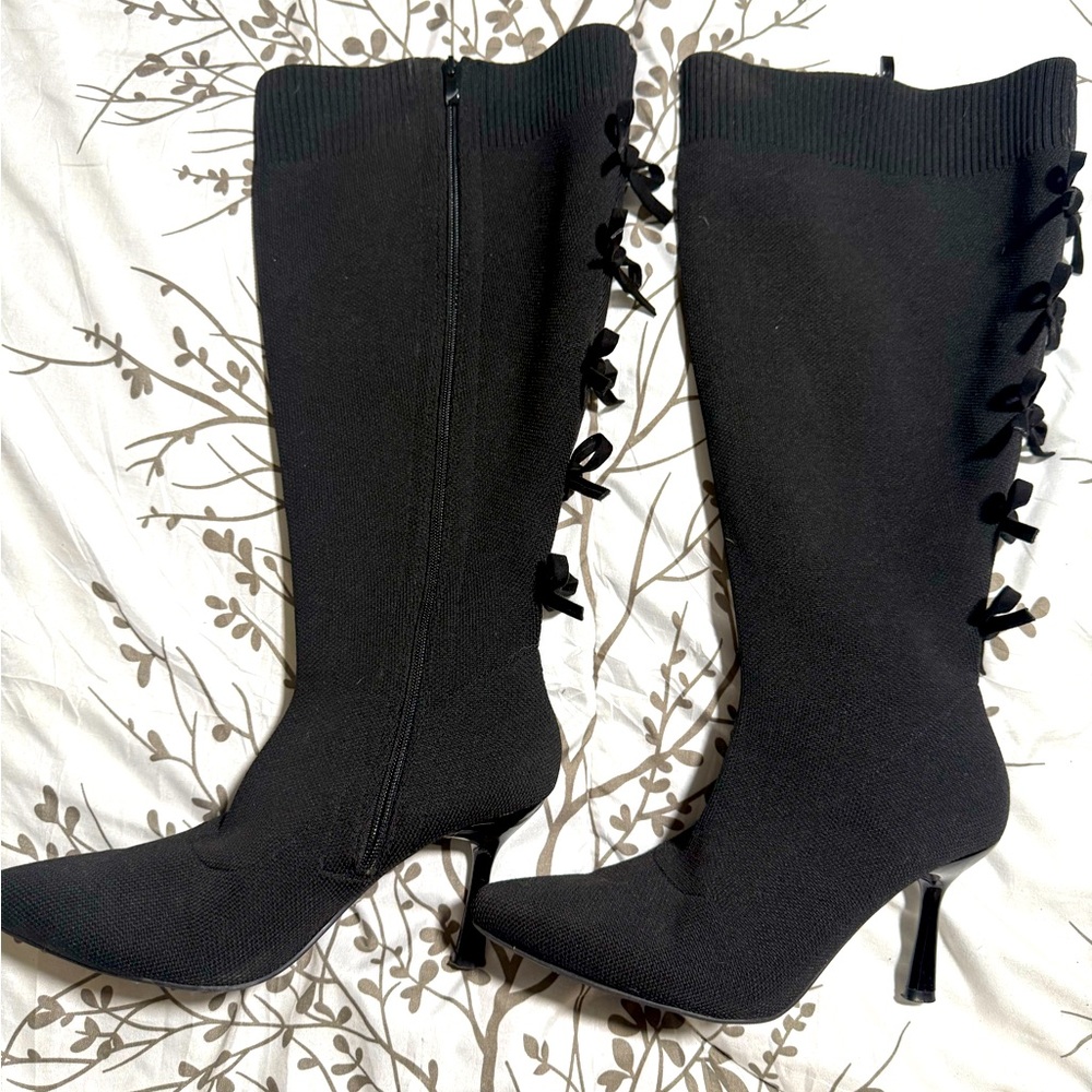 Knew high wide calf boots with heels. Elastic and stretchy.